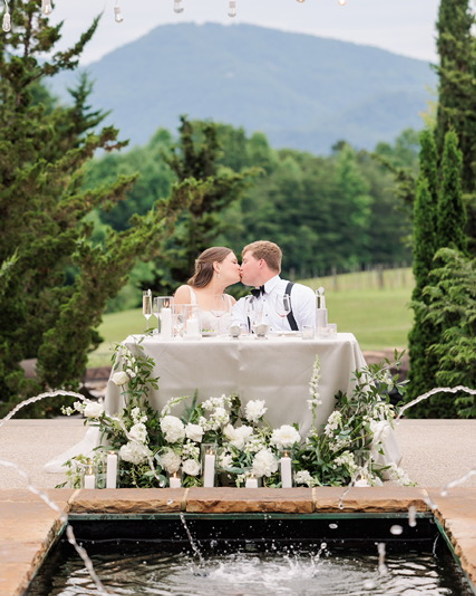 Sweetheart table celebration with a mountain-view backdrop